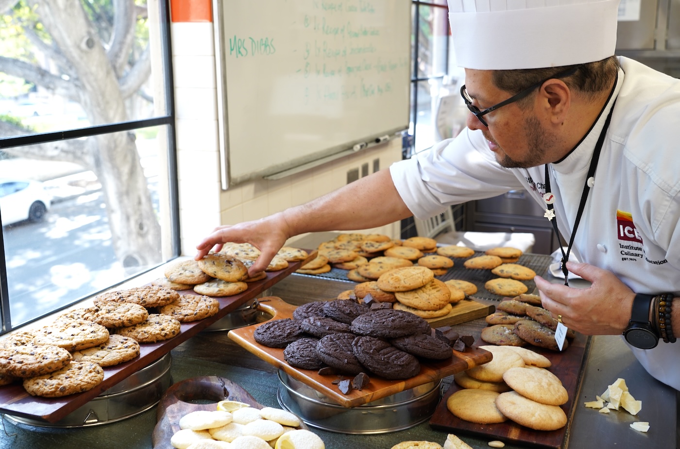 ICE Chef Stephen Chavez sets a cookie on a cookie display