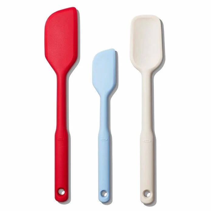 Three rubber spatulas in red, blue and white