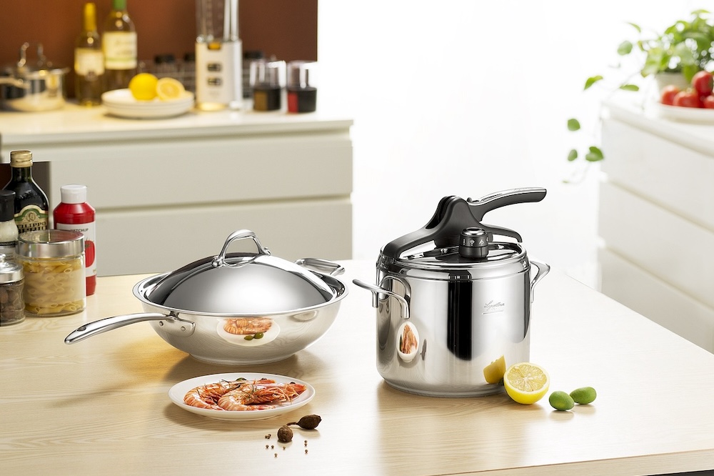 Pots, pans and ingredients on a wooden counter