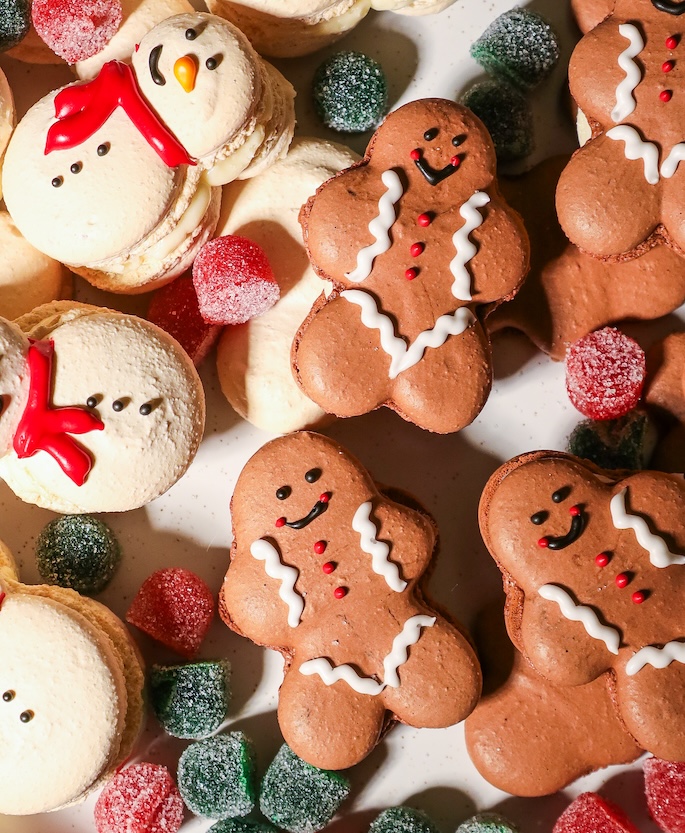 Gingerbread and snowman macarons on top of gumdrops