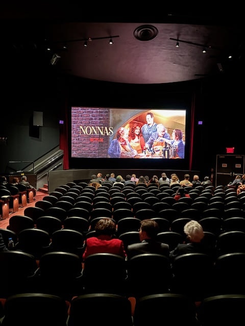 viewers watch nonnas film screening in theater