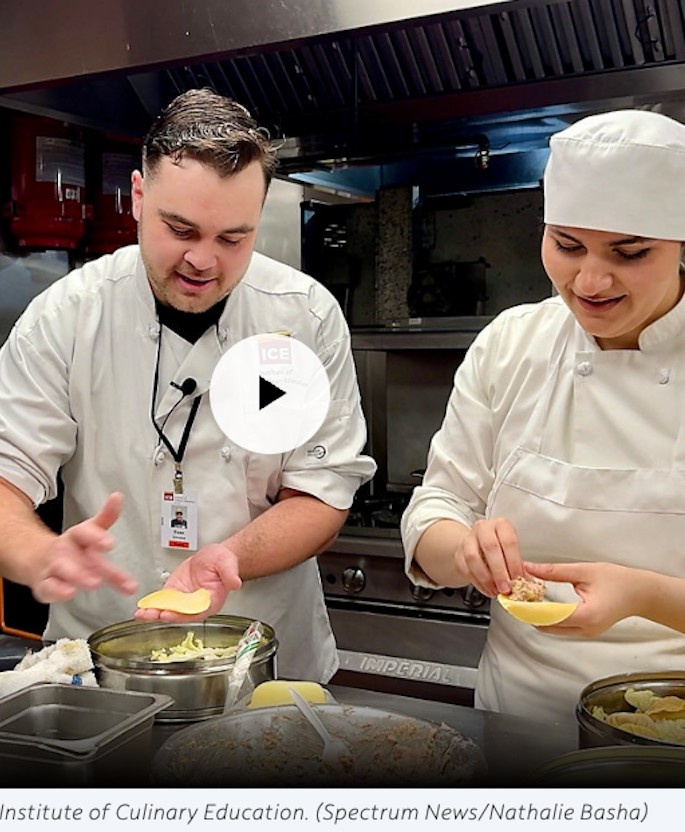Two students filling dumplings