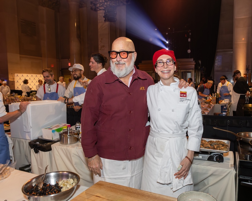 Celebrity Chef Andrew Zimmern and ICE culinary student volunteering at the Autism Speaks event in NYC.