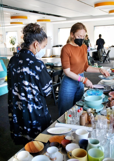 Chef Adrienne Cheatham curates props at her cookbook photoshoot.