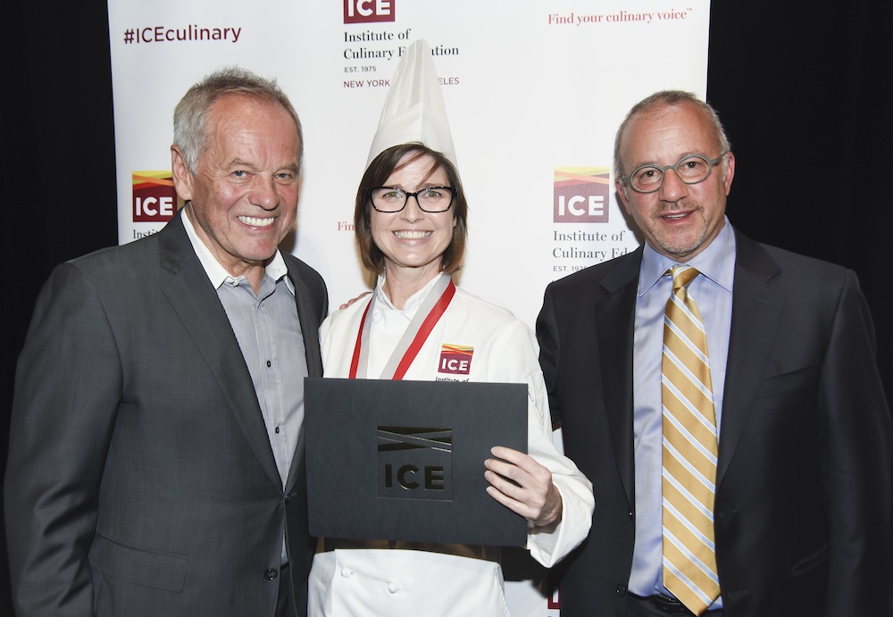 Cher poses with Chef Wolfgang Puck and ICE CEO Rick Smilow at her graduation.