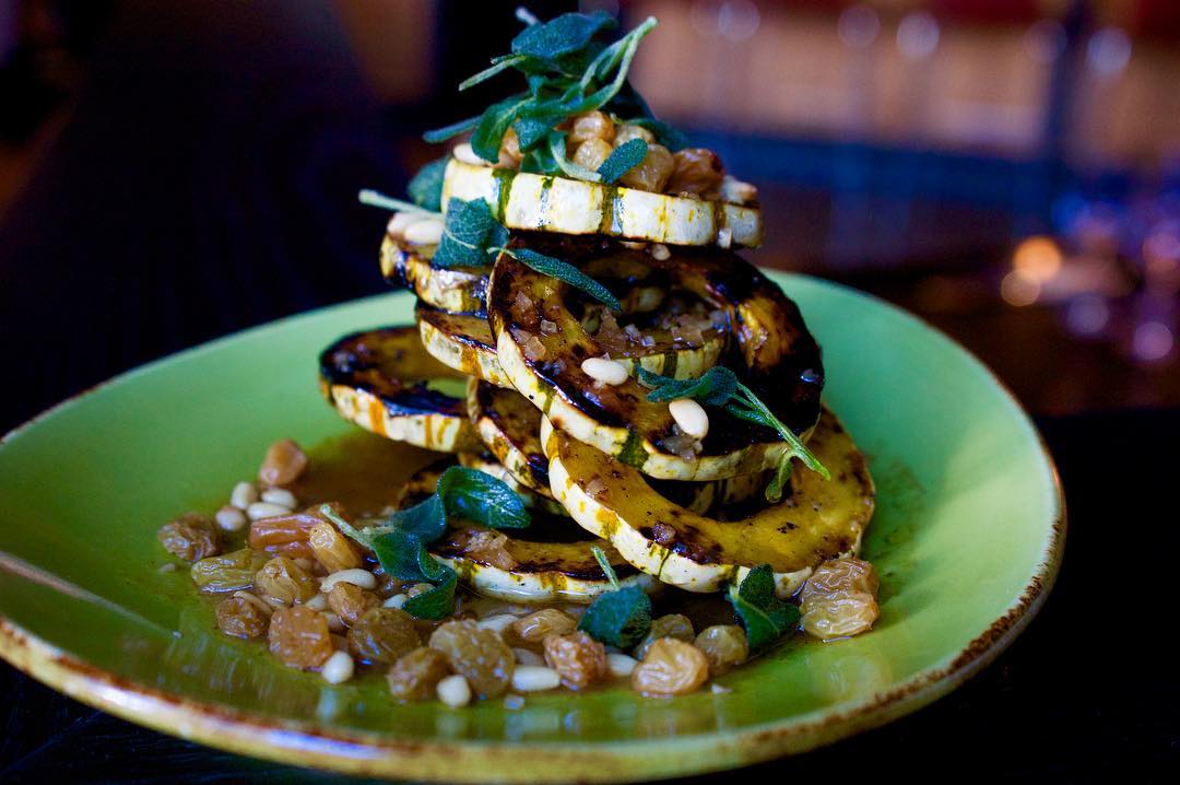 Chef Troy Guard stacks Delicata Squash at Guard and Grace in Denver. Photo courtesy of TAG Restaurant Group.