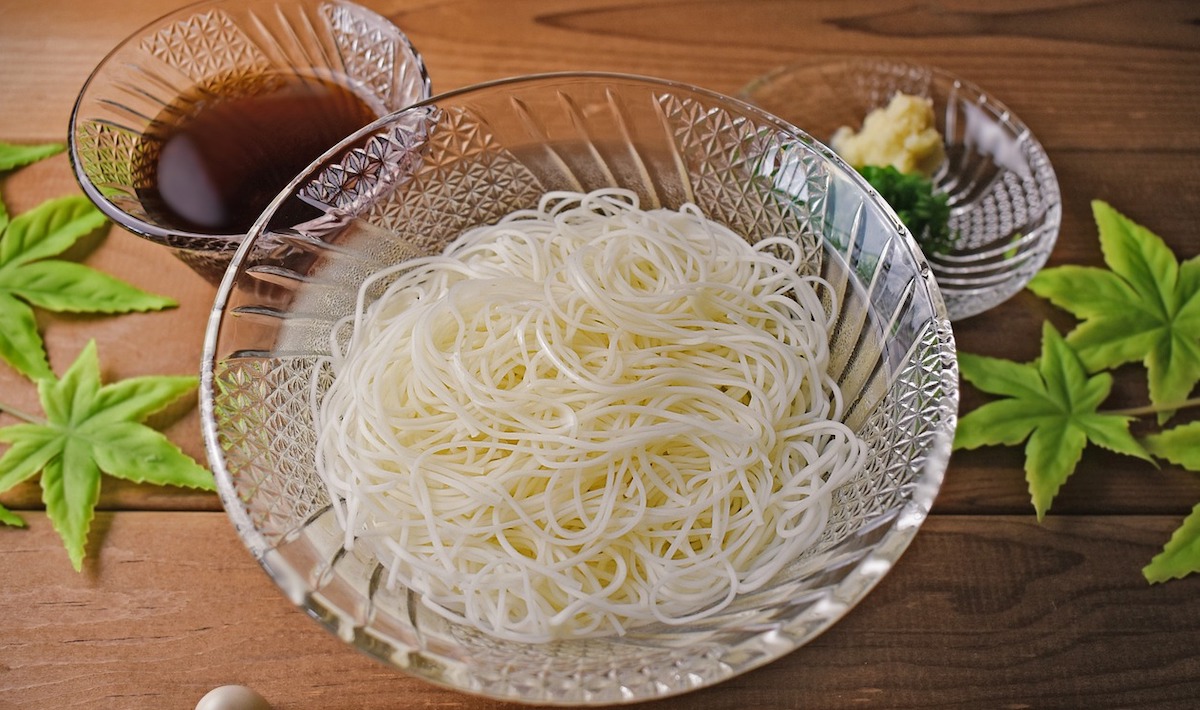 Somen noodles sit in a crystal bowl