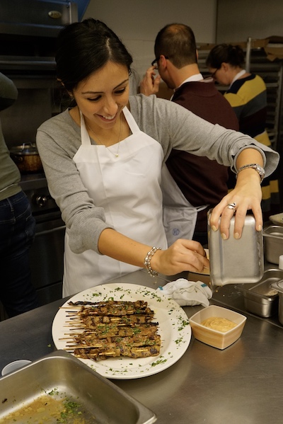 A participant makes a Thai dish in an ICE recreational class