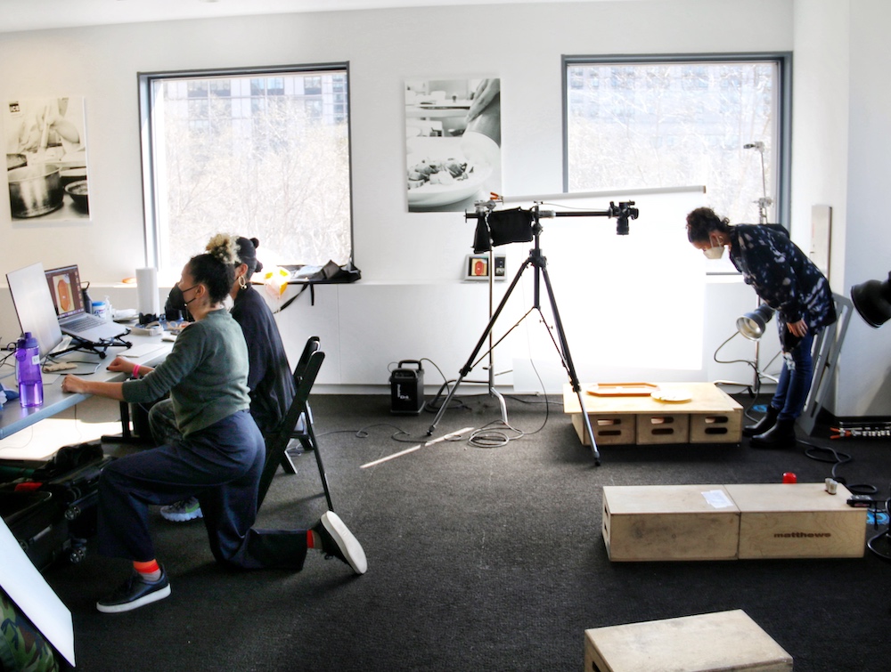 Chef Adrienne works with photographers and food stylists on the photos for her cookbook.