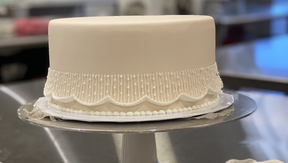 cake with string work piping
