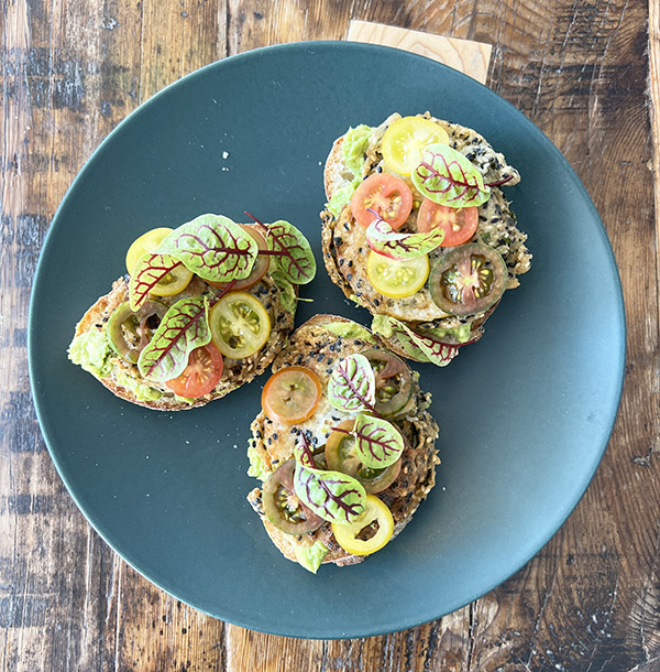 Avocado toast with fried pickled green tomatoes.