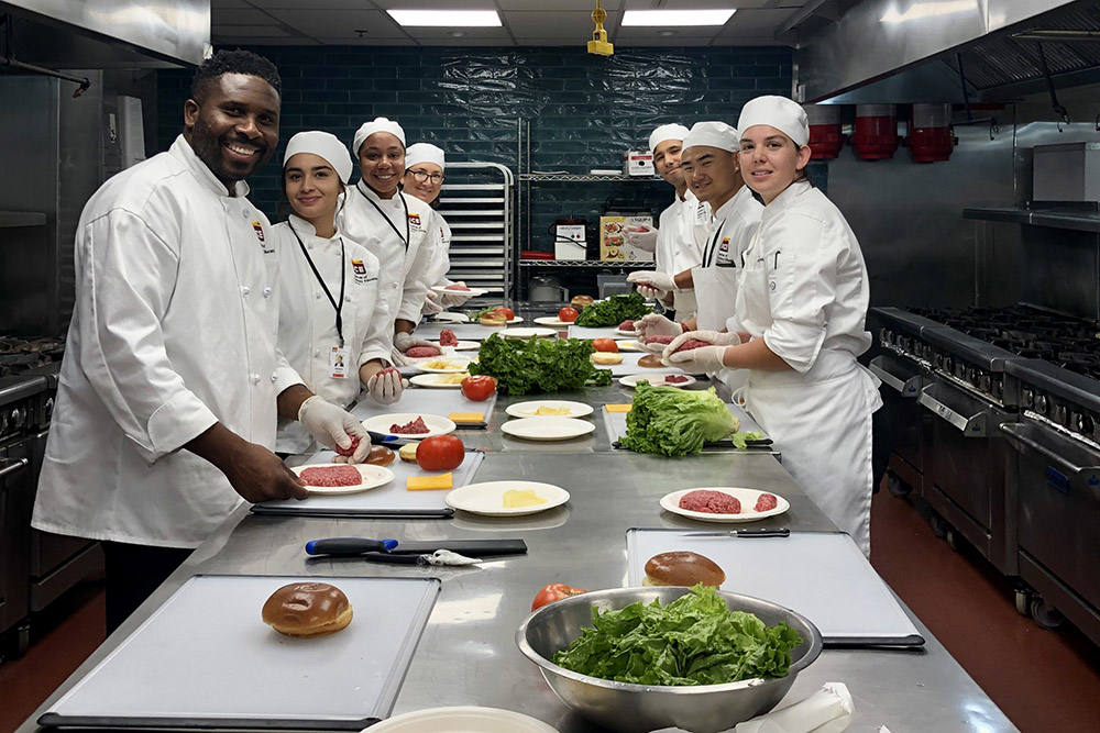 ICE students style food in a photography workshop.