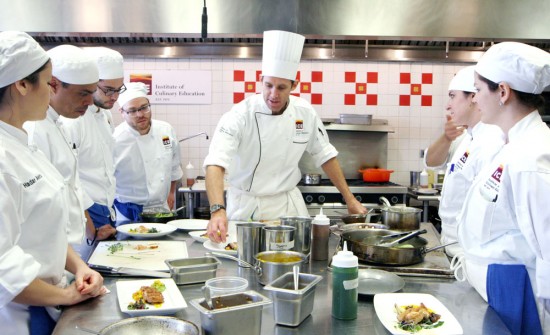 Chef instructor teaching students the art of plating at school in new york