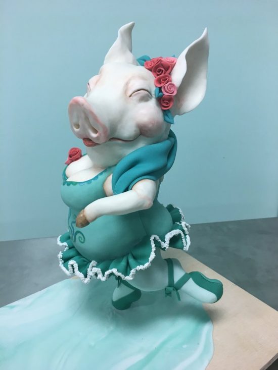 cake carved into ballerina pig