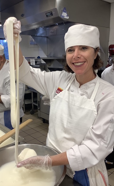 Suzanne Trice making cheese