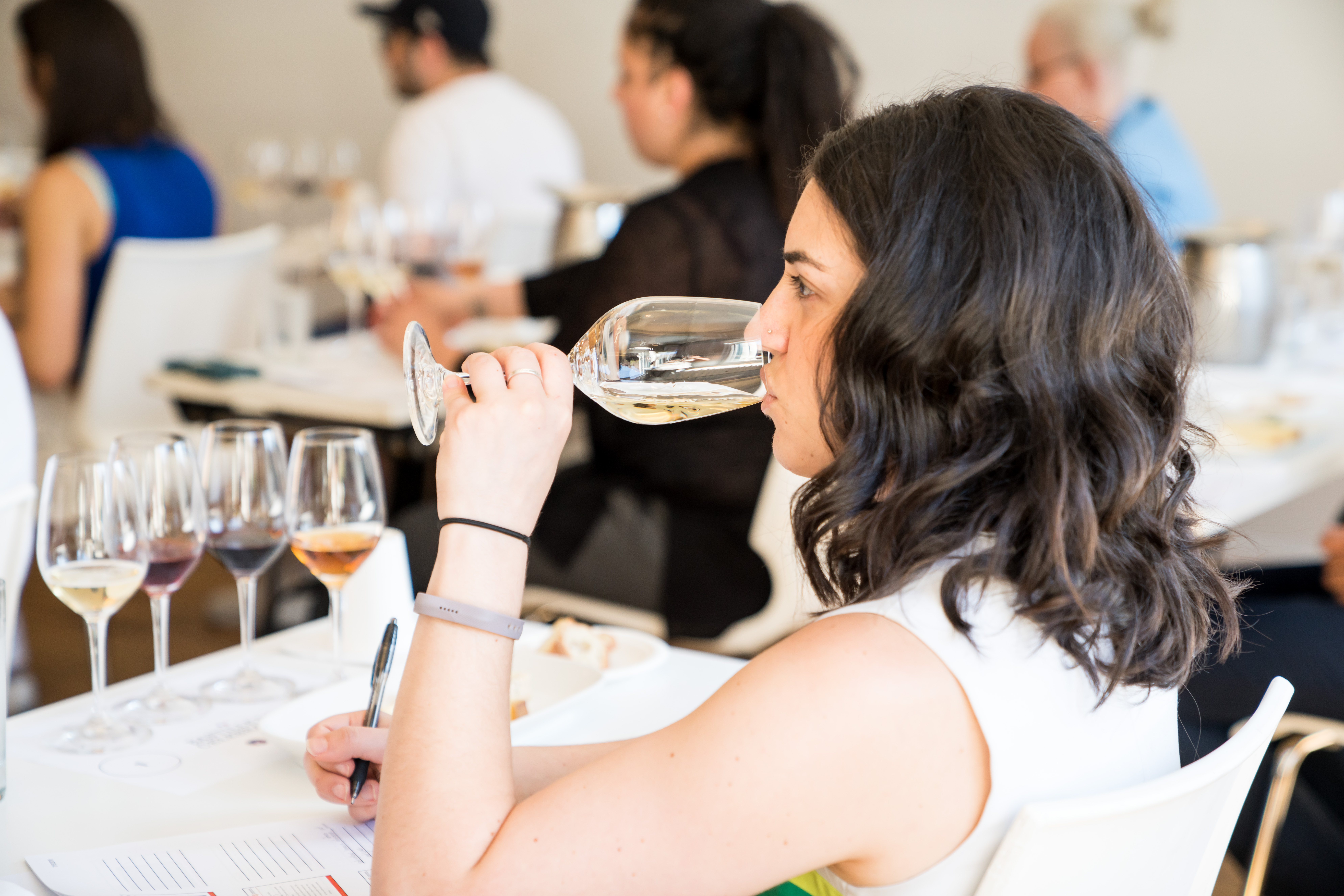 A student sniffs wine in Intensive Sommelier Training