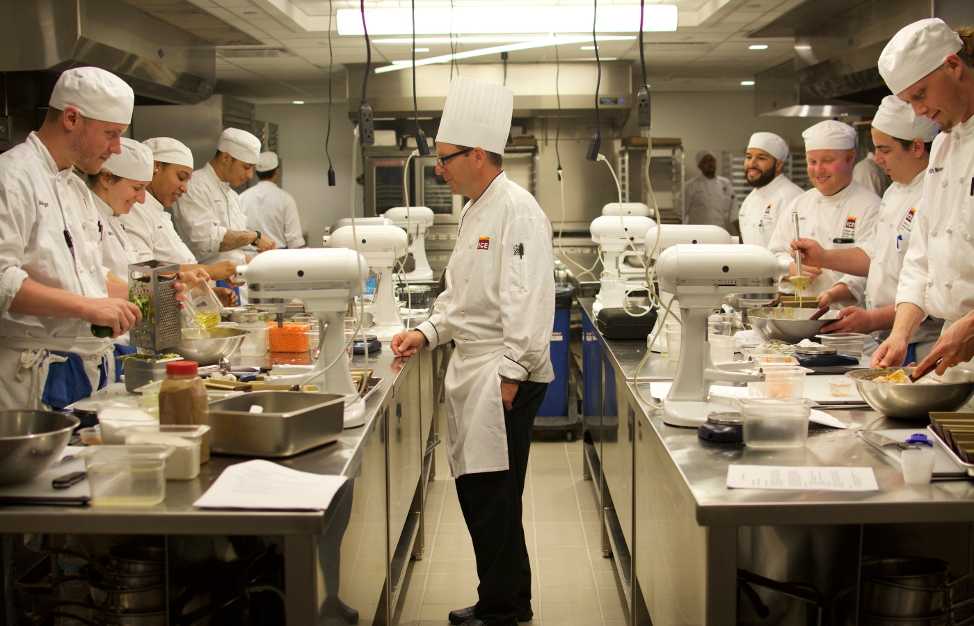 students cooking in career kitchen