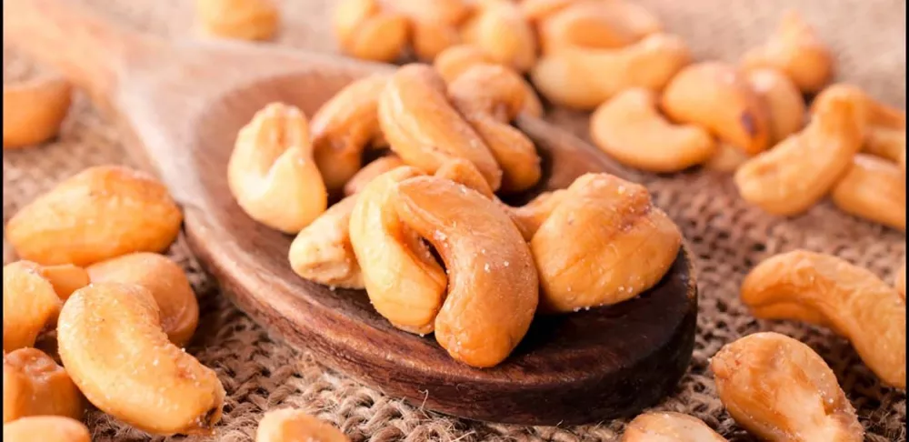 Cashews and spoon on a table