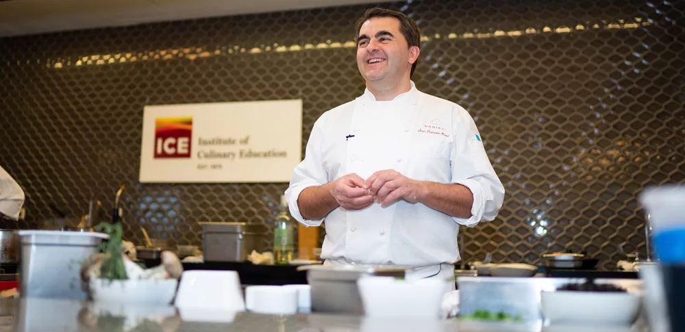 Chef Jean-François Bruel speaks to students at ICE during an Elite Chef demo