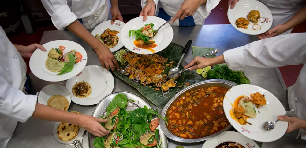 cooks eating family meal at a restaurant