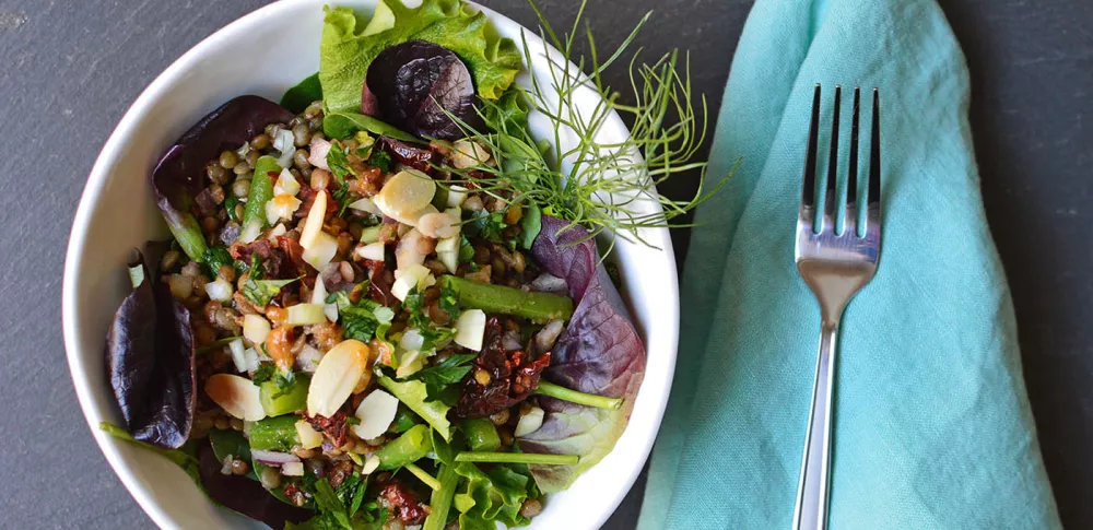 A lentil salad is served.