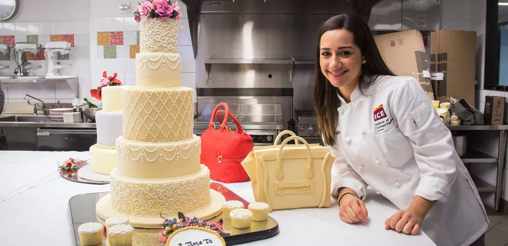 Olivia Moglino displays her final project in The Art of Cake Decorating in 2016.