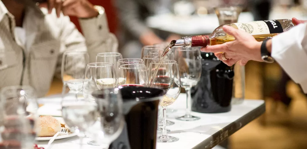 wine being poured at a tasting