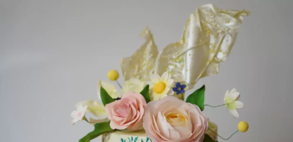 A cake decorated with rice paper sails