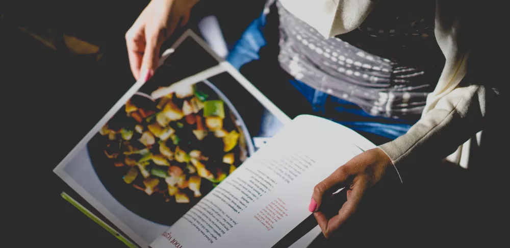 A person reads a recipe.