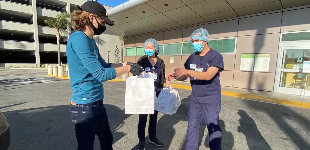 Mattia Corbia delivers prepared meals to health care workers.