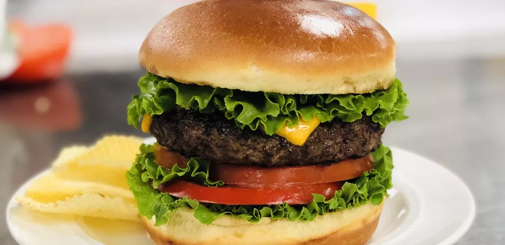 A burger is styled for photography.