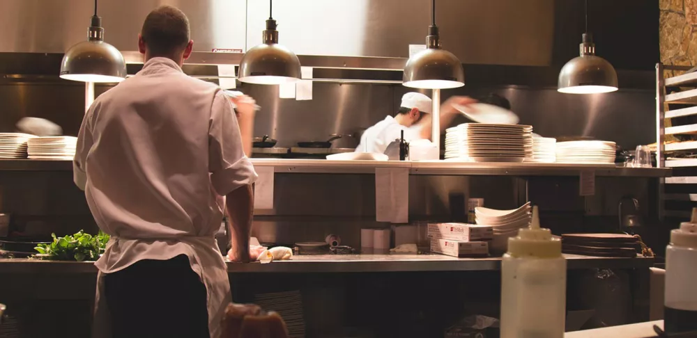 A chef expediting in the kitchen.