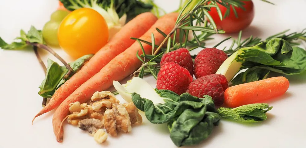 A selection of fruits and vegetables on a white background