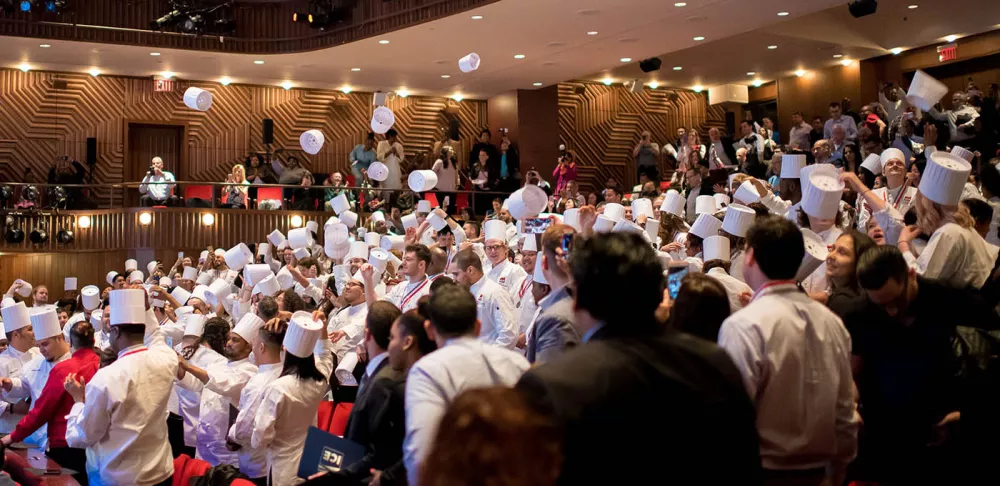 ICE graduates toss their toques at the 2018 graduation commencement.