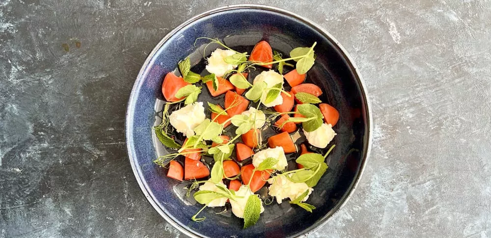 A plate of radishes and chèvre.