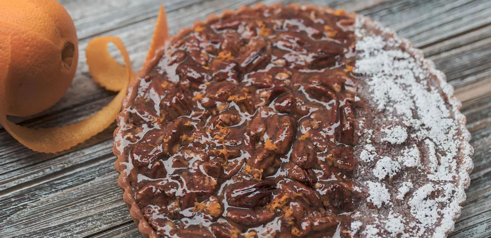 Pecan pie with orange zest and smoked salt