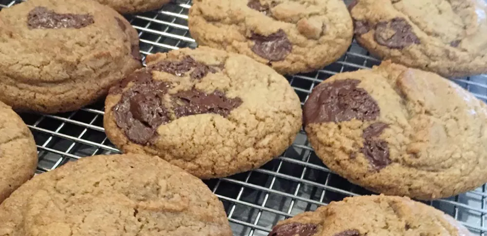 Penny Stankiewicz cools a rack of freshly baked chocolate chip cookies.