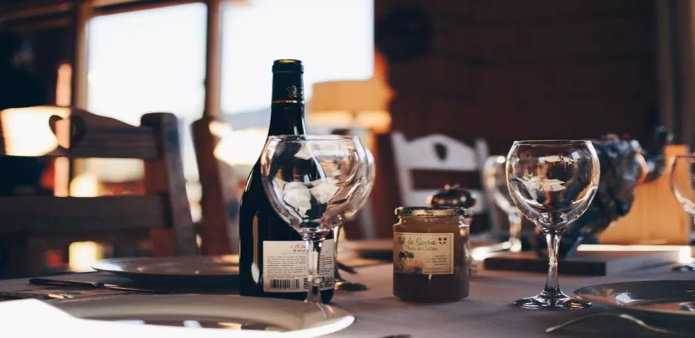 Wine bottle and glasses on a dining table