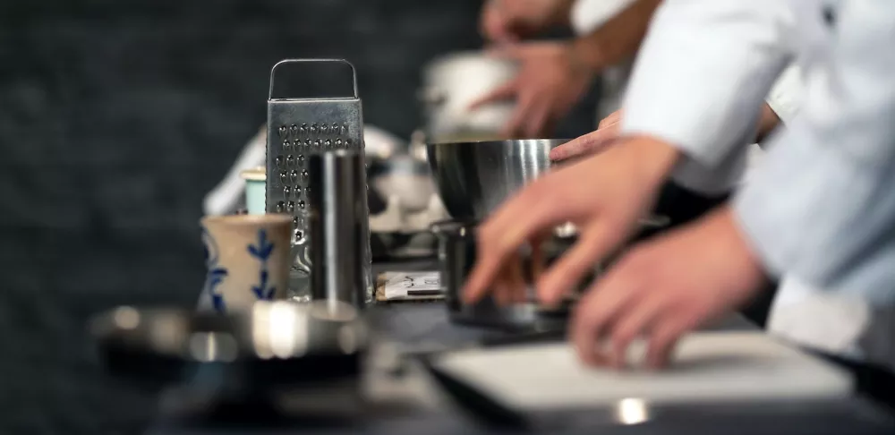 Culinary professionals work in a restaurant kitchen