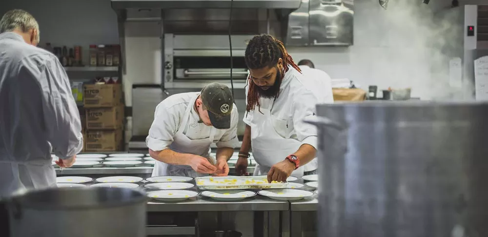 Chefs working on the line.