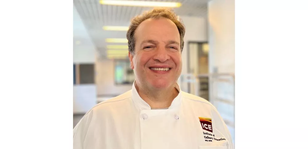 Pastry Chef Richard Kennedy smiles in the ICE hallway