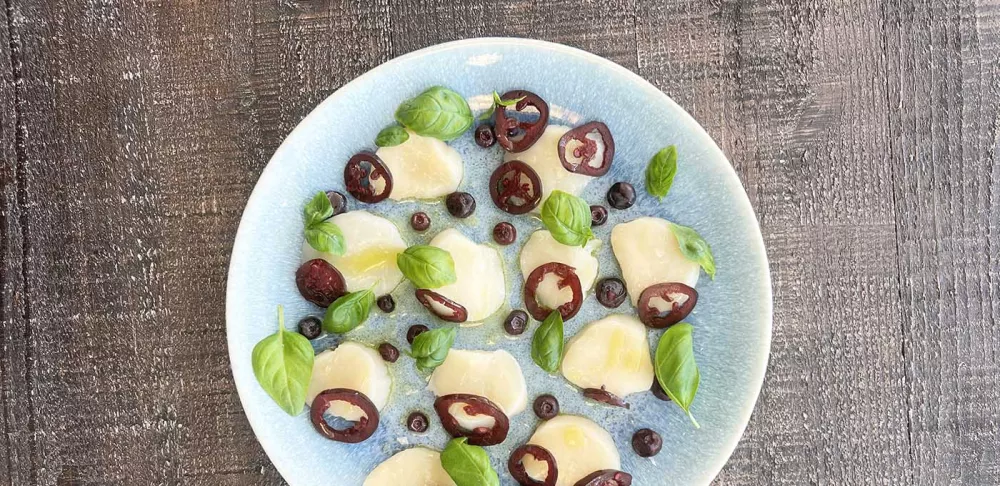 Scallop crudo with fermented jalapeños.