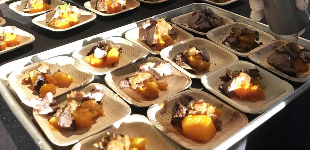 A tray of samples at a food festival.