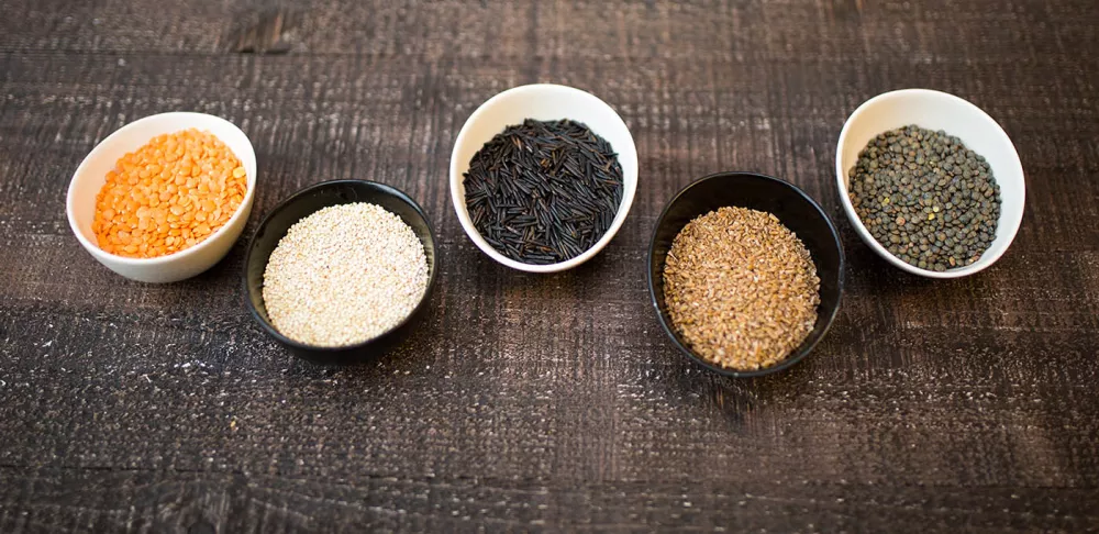 Bowls of whole grains and lentils