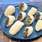 Ten Fermented Seven Spice Mango Onigiri rice balls sit on a blue plate