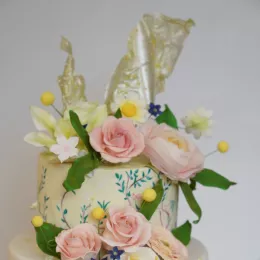 A cake decorated with rice paper sails