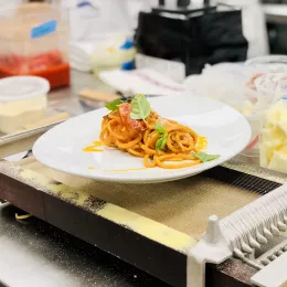 Chef Bruce Kalman's Spaghetti alla Chitarra plate is presented after a demo at ICE LA.