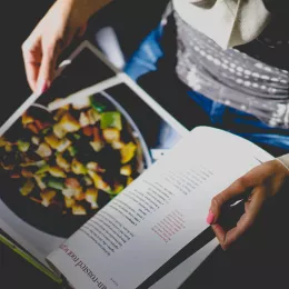 A person reads a recipe.