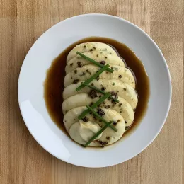 Hay Smoked Ratte Potatoes with Crème Fraiche and Chives