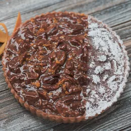 Pecan pie with orange zest and smoked salt